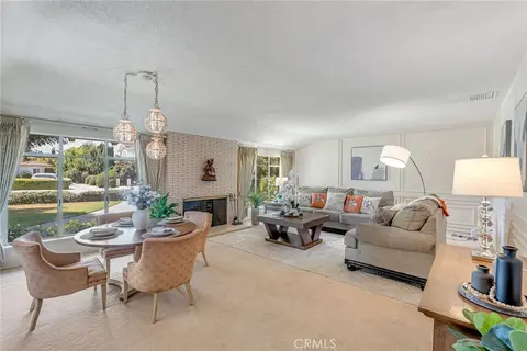205 W Longden Ave — living and dining rooms with street-facing windows