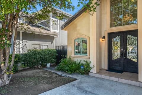 6522 N Golden West Ave — double front doors