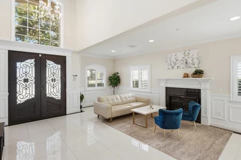 6522 N Golden West Ave — living room, fireplace, and front doors