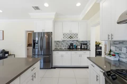 6522 N Golden West Ave — kitchen counters and refrigerator