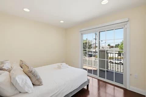 6522 N Golden West Ave — bedroom with a door to the balcony